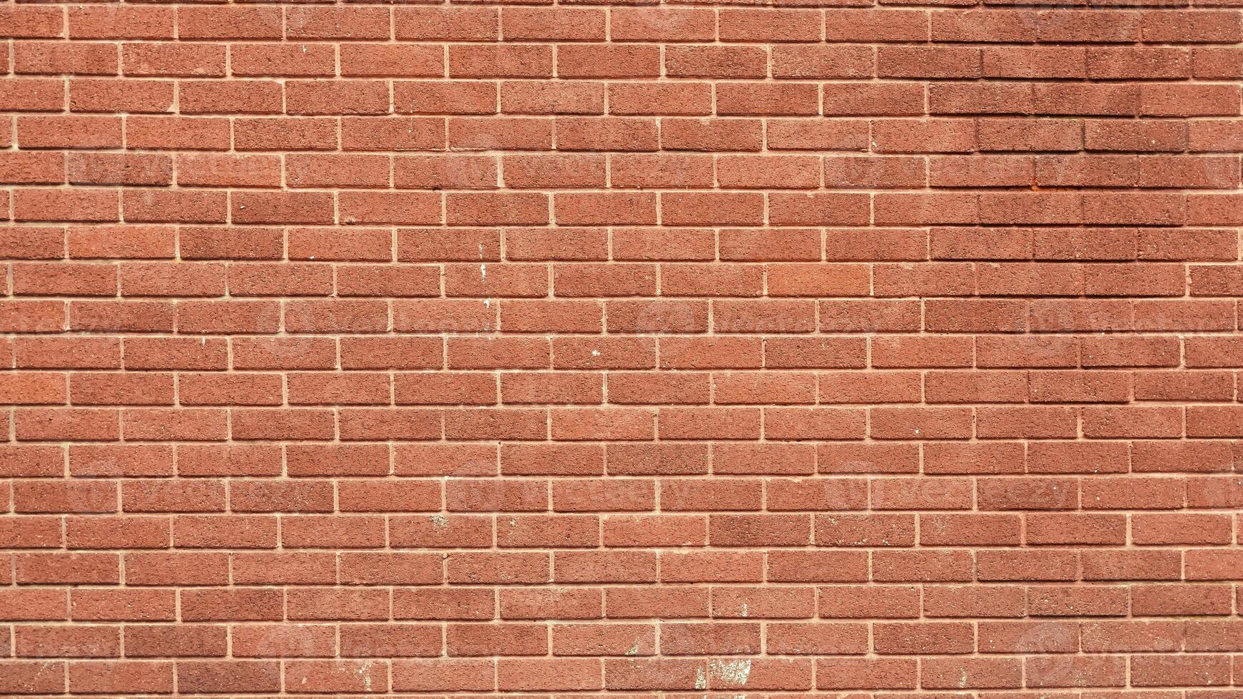brick wall with a rough texture and classic architectural style. photo