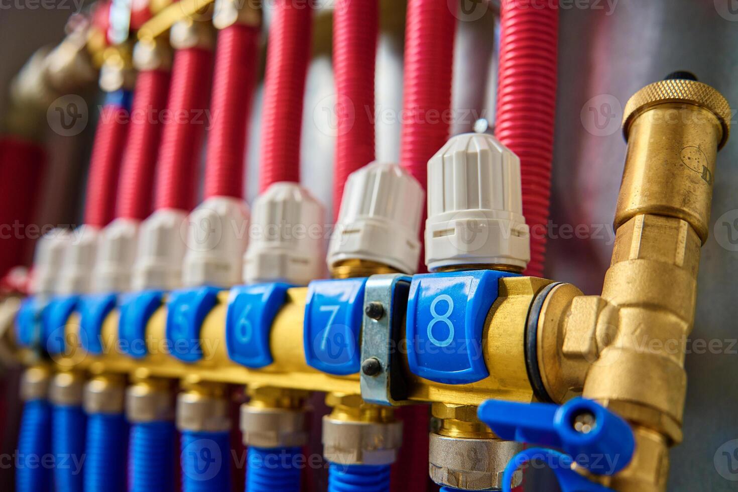 Underfloor heating manifold with valves and flow meters, close up photo