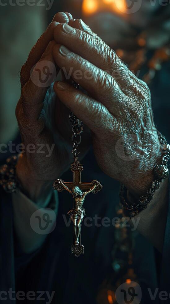 priest praying with rosary and crucifix in church photo