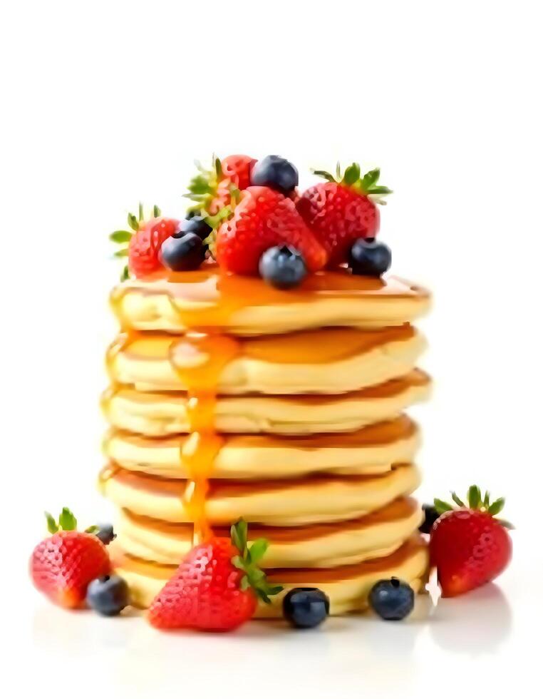 Stack of pancakes with berries and maple syrup isolated on white background. photo