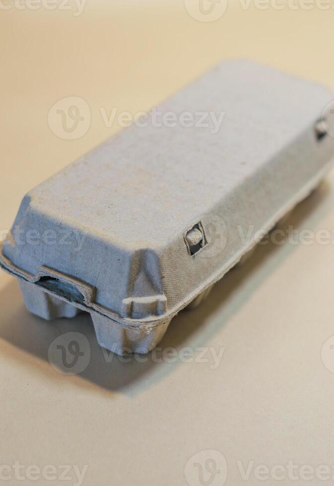 Closed Egg Carton. Top-down view of grey, recycled cardboard container. High quality photo