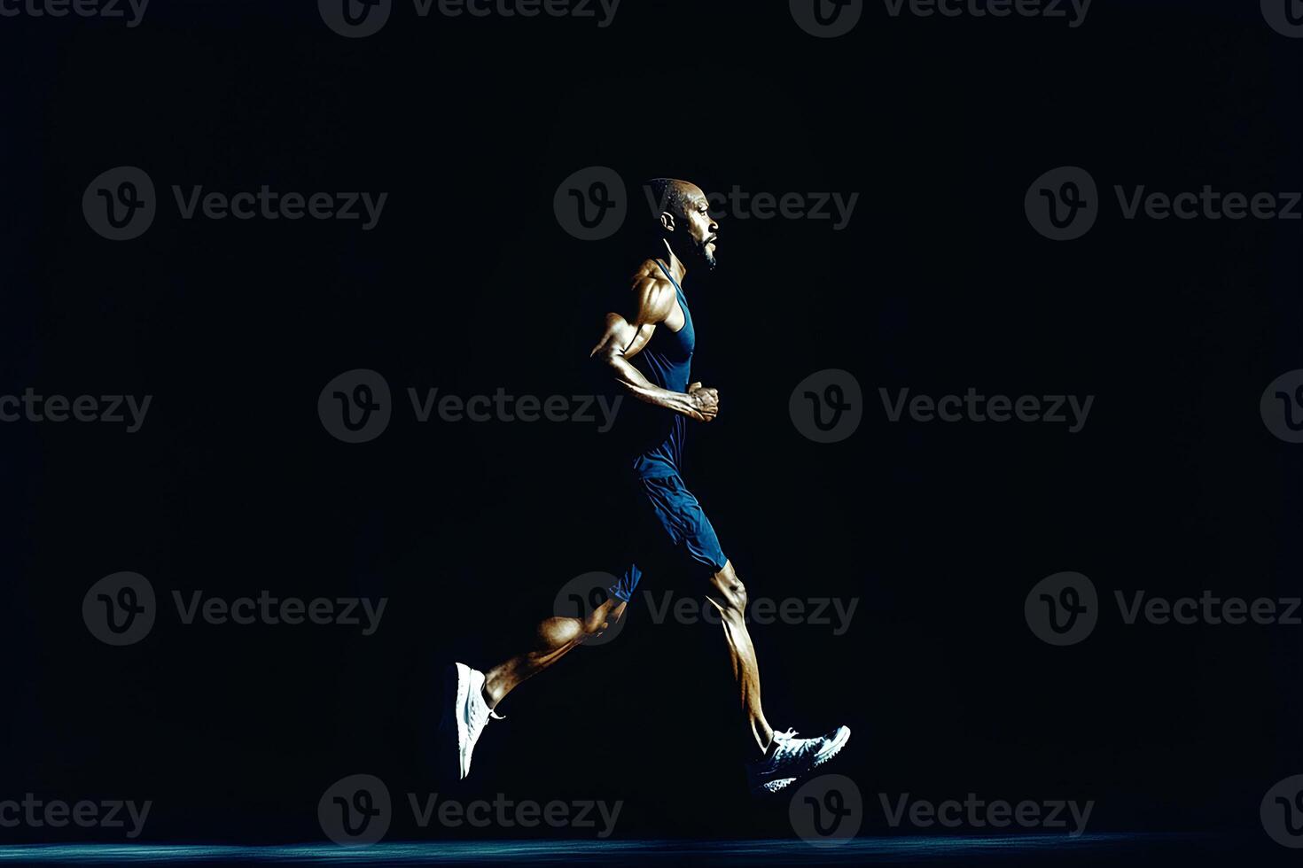 A dynamic full-length portrait of a man running, captured in motion against a solid black background. The image embodies energy, determination, and the power of sport and athleticism photo