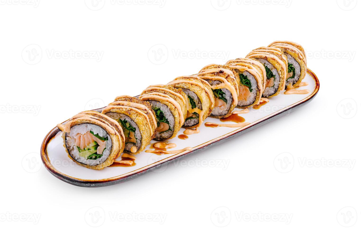Delicious sushi rolls with fresh salmon and avocado served on a decorative plate photo