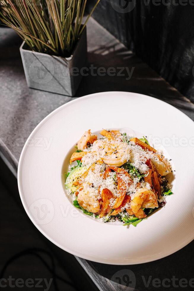Delicious shrimp pasta dish served in a stylish restaurant setting with fresh ingredients photo