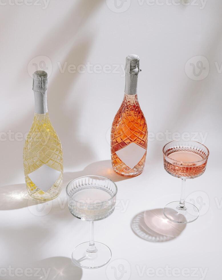 Celebration drinks on display with sparkling bottles and elegant glasses arranged on a white surface photo