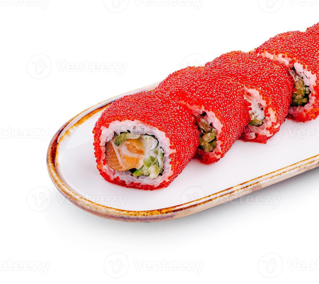 Unique sushi rolls topped with vibrant red fish roe served on a traditional plate photo