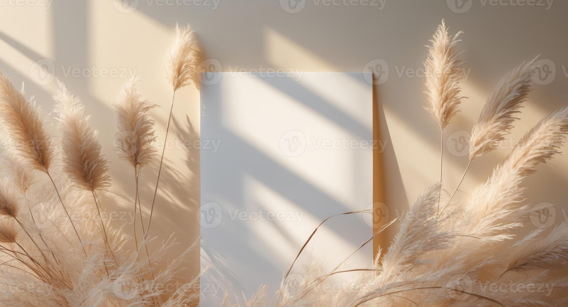Blank paper mockup with dried pampas grass and sunlight. photo