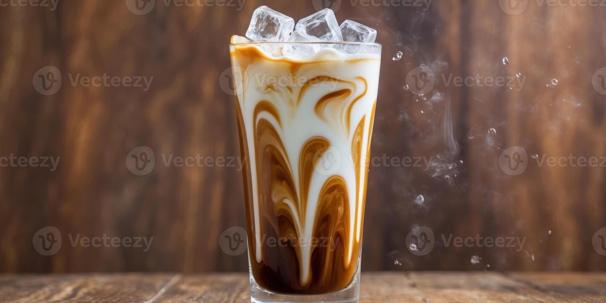 A vibrant iced coffee with milk swirling as it poured into a tall glass filled with ice cubes photo