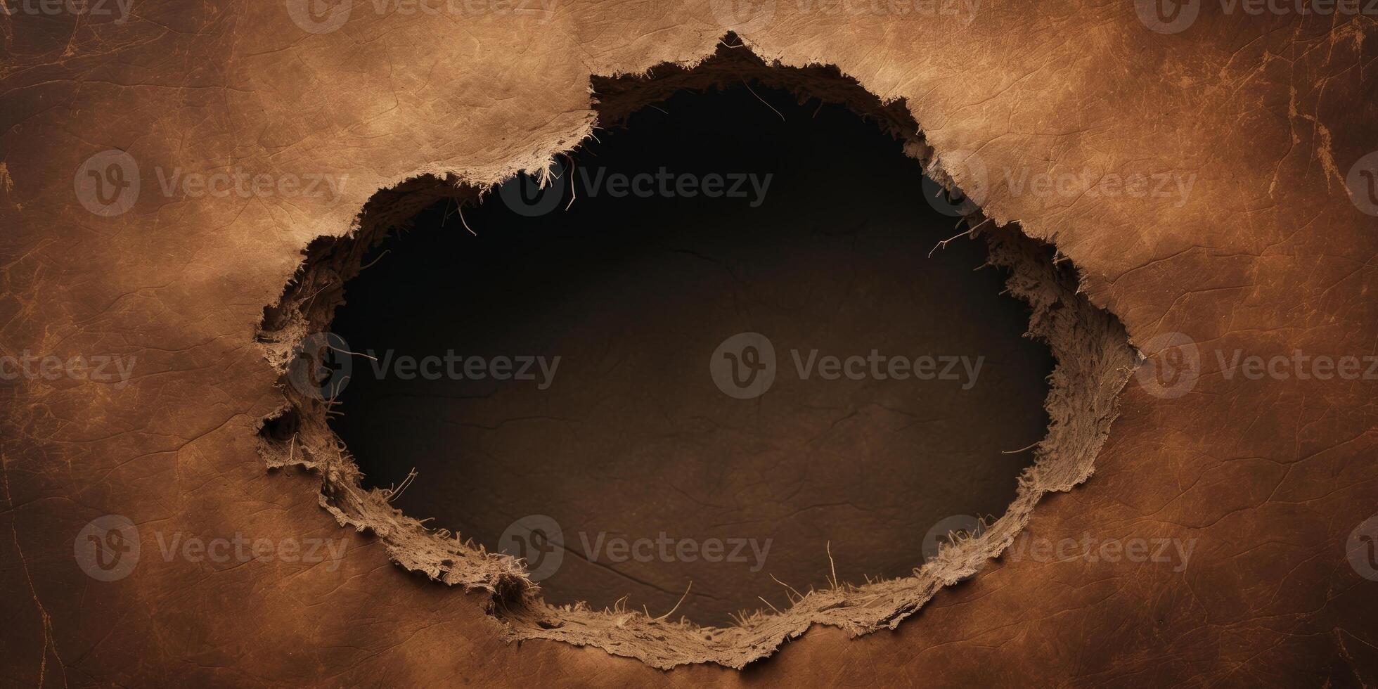 A brown background with a large hole in it. photo