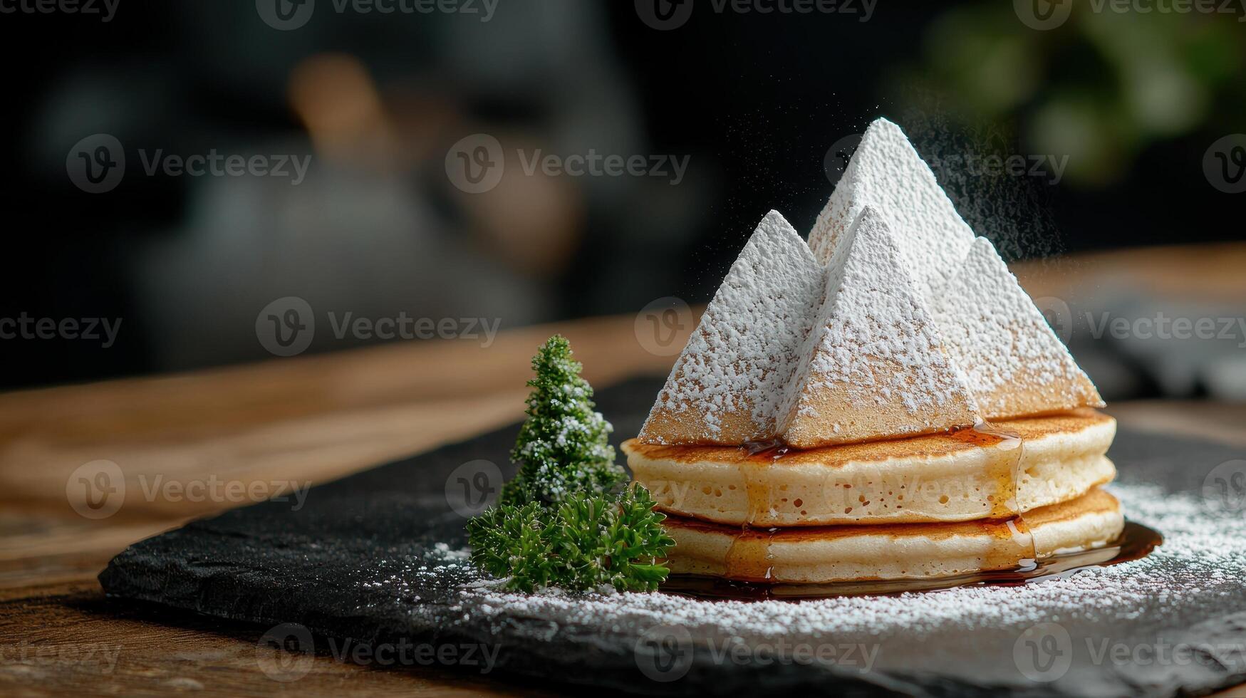 Fluffy pancakes with powdered sugar and maple syrup photo
