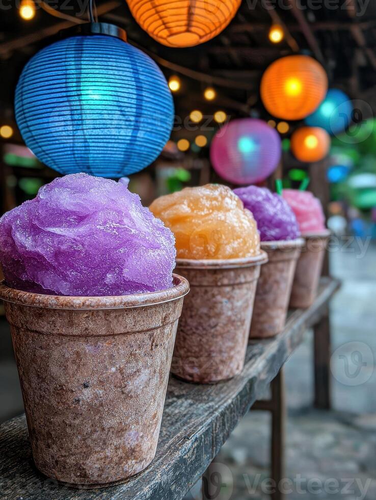 Colorful shaved ice treats lined up on a wooden counter photo