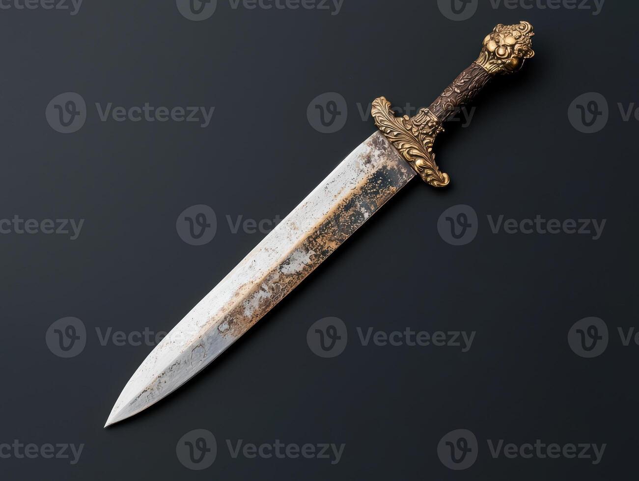An ornate antique sword on a dark background photo