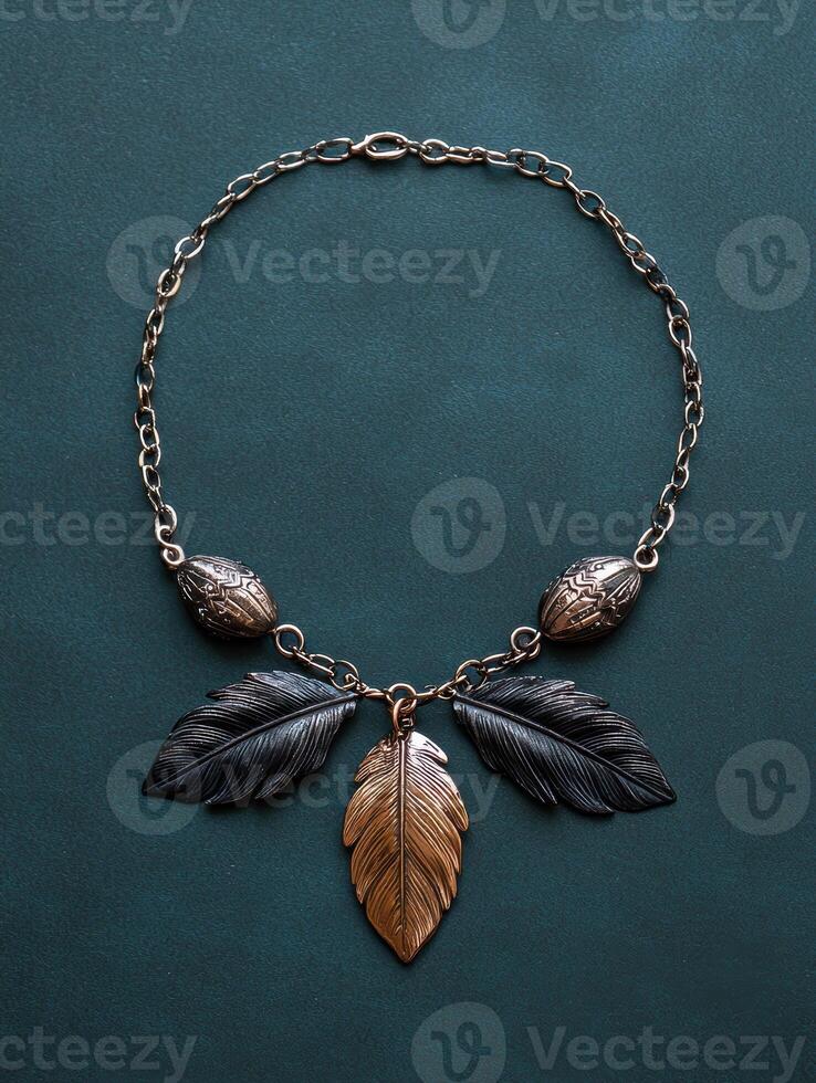 Necklace with feathers and beads on a dark background photo
