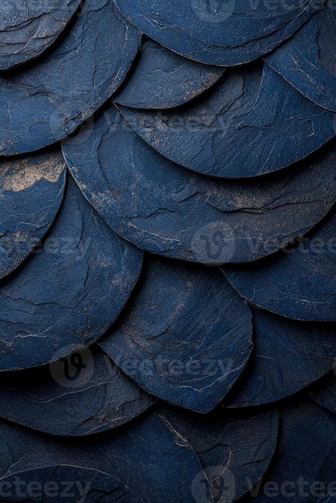 Overlapping blue stone tiles creating a textured pattern photo
