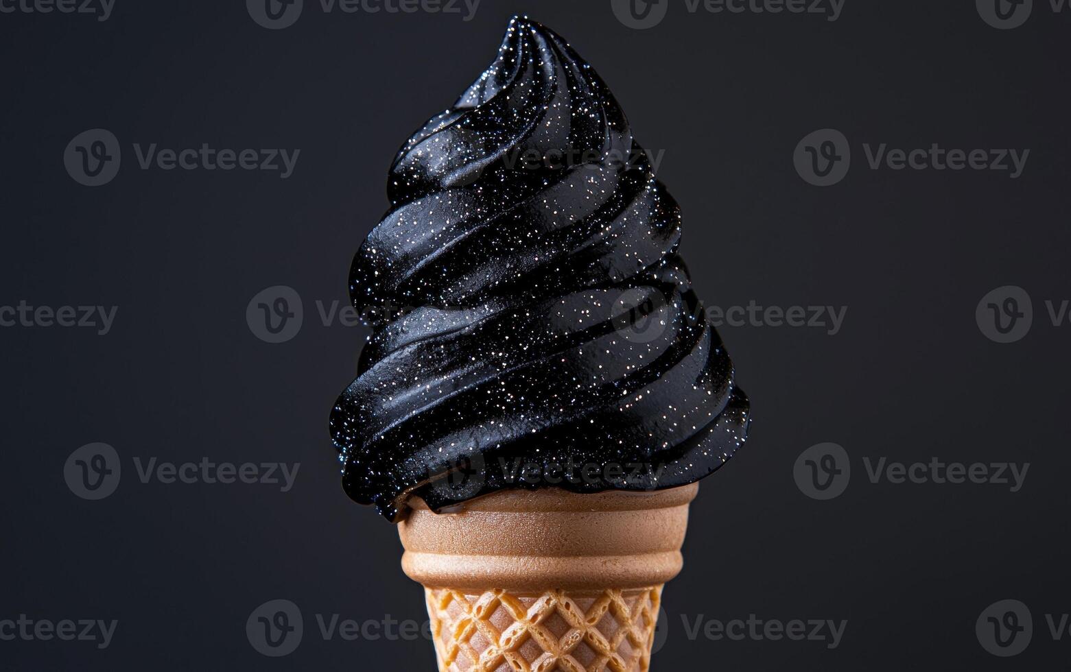 A cone of black ice cream with glitter photo