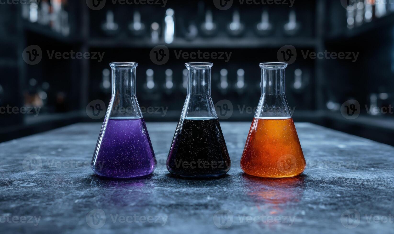 Three beakers filled with colorful liquids on a table in a laboratory photo