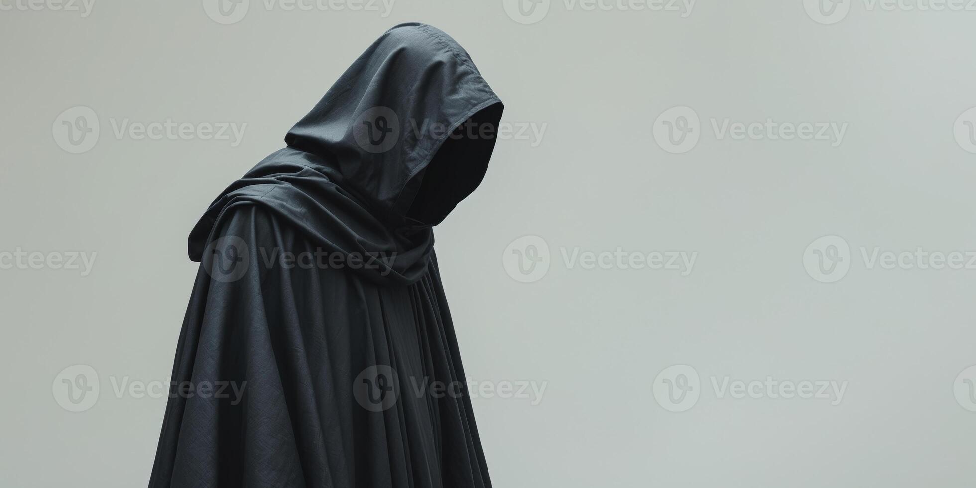 Mysterious Figure in a Dark Hooded Cloak photo