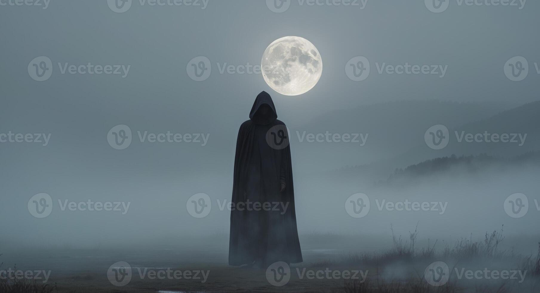 A person in a cloak standing in front of a full moon photo