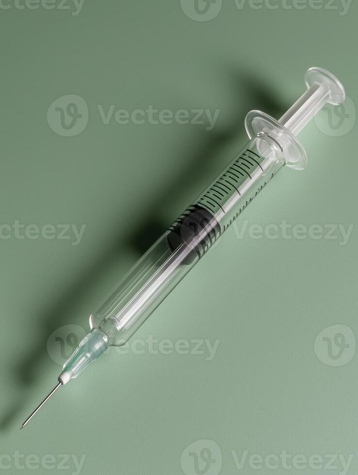 A syringe on a green background photo