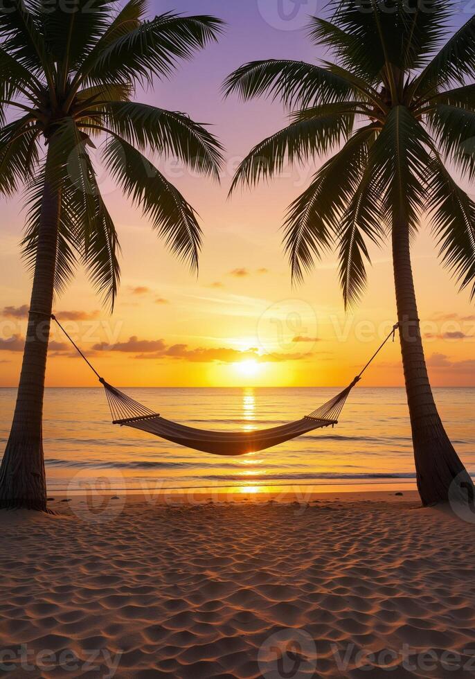 Tranquil Sunset Over Hammock Between Two Palm Trees on Beach photo