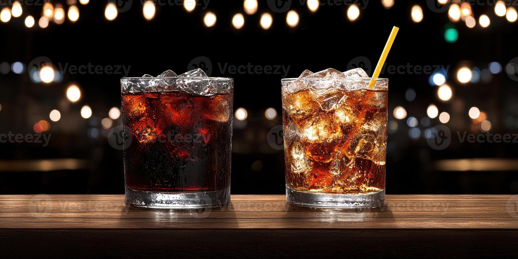 Two glasses of cola with ice on a bar photo