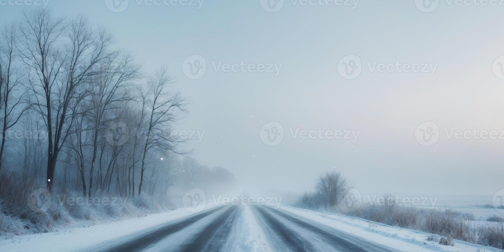 Snowy road leading to horizon in winter landscape. photo