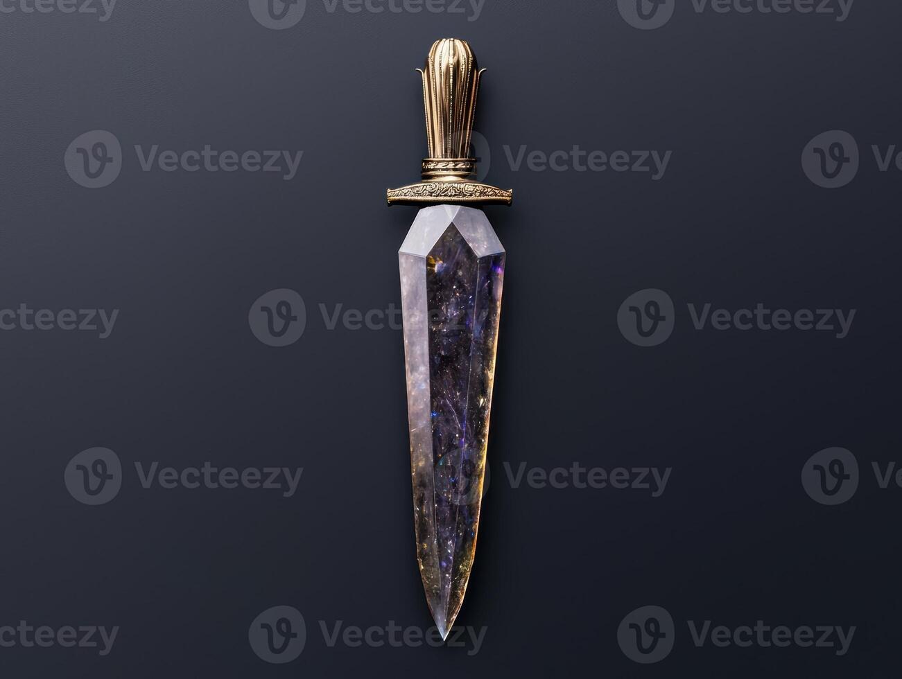 A crystal dagger with a golden hilt on a dark background photo