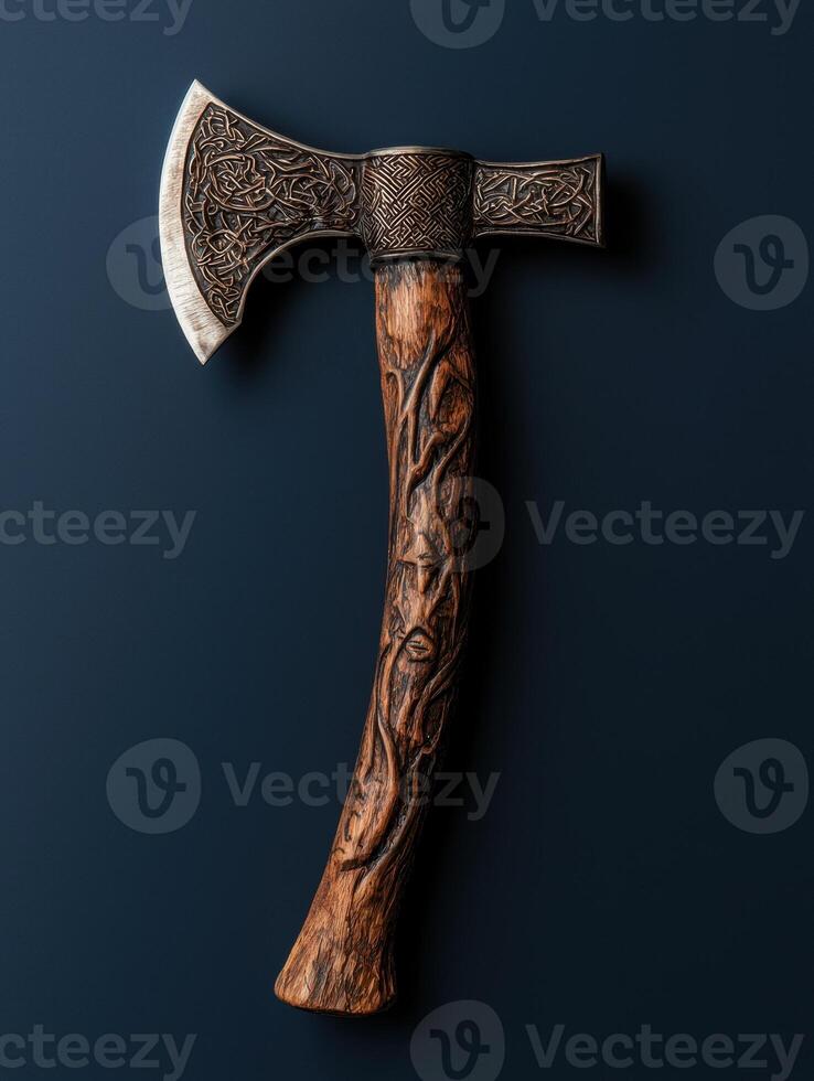 A decorative battle axe with intricate carvings photo