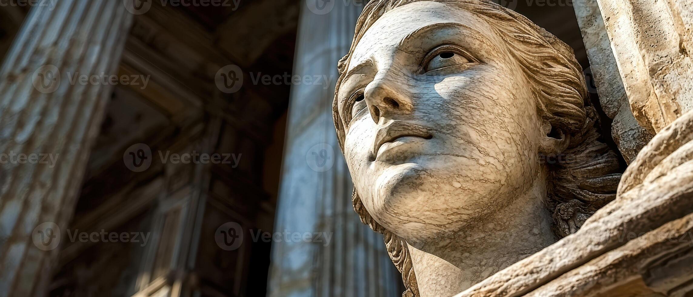 Marble statue of a woman looking up photo