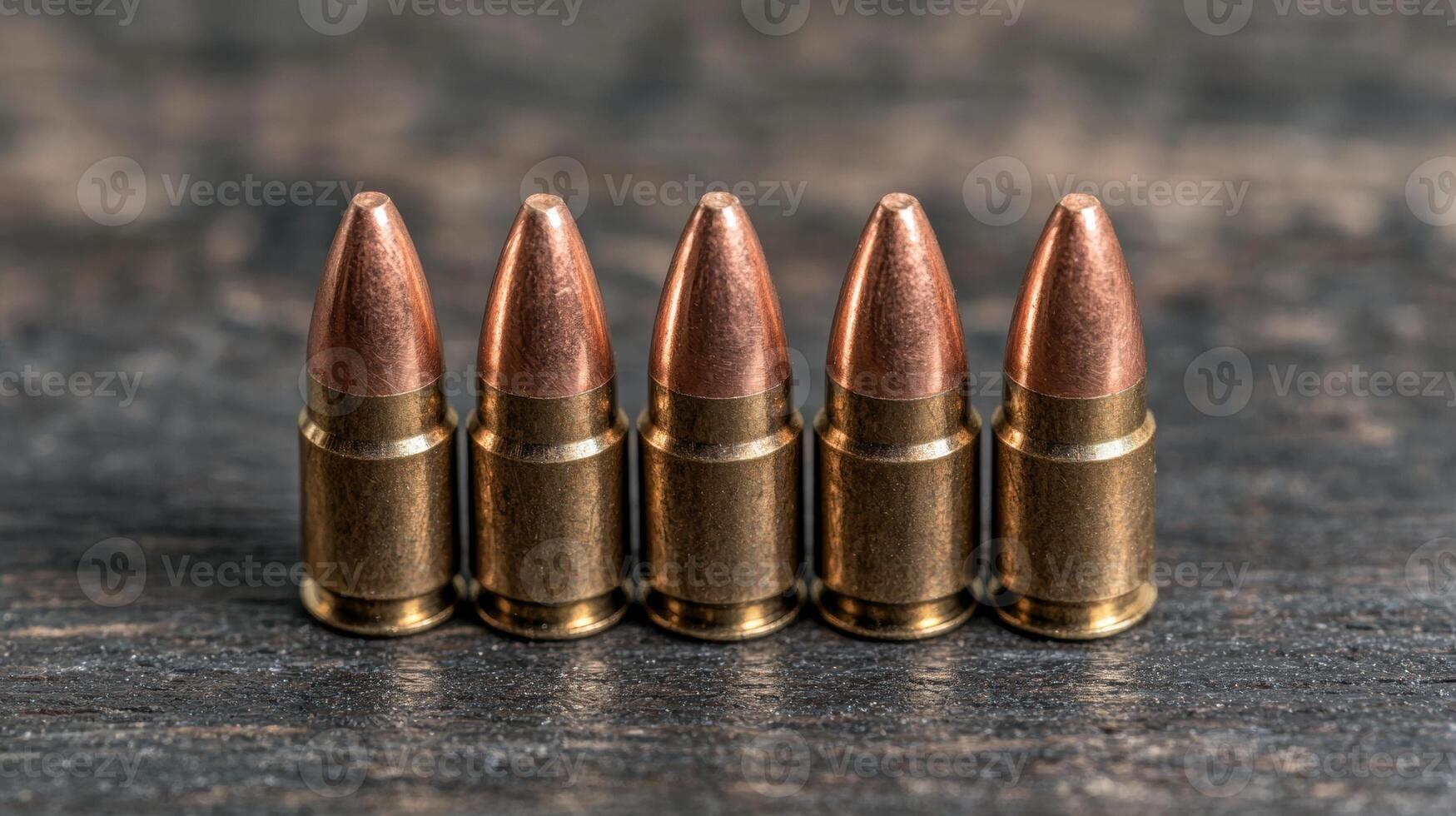 Some ammunition lined up on a wooden surface. photo