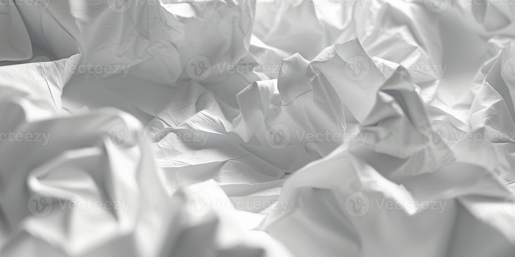 Textured background of crumpled and folded paper forming an abstract design. photo