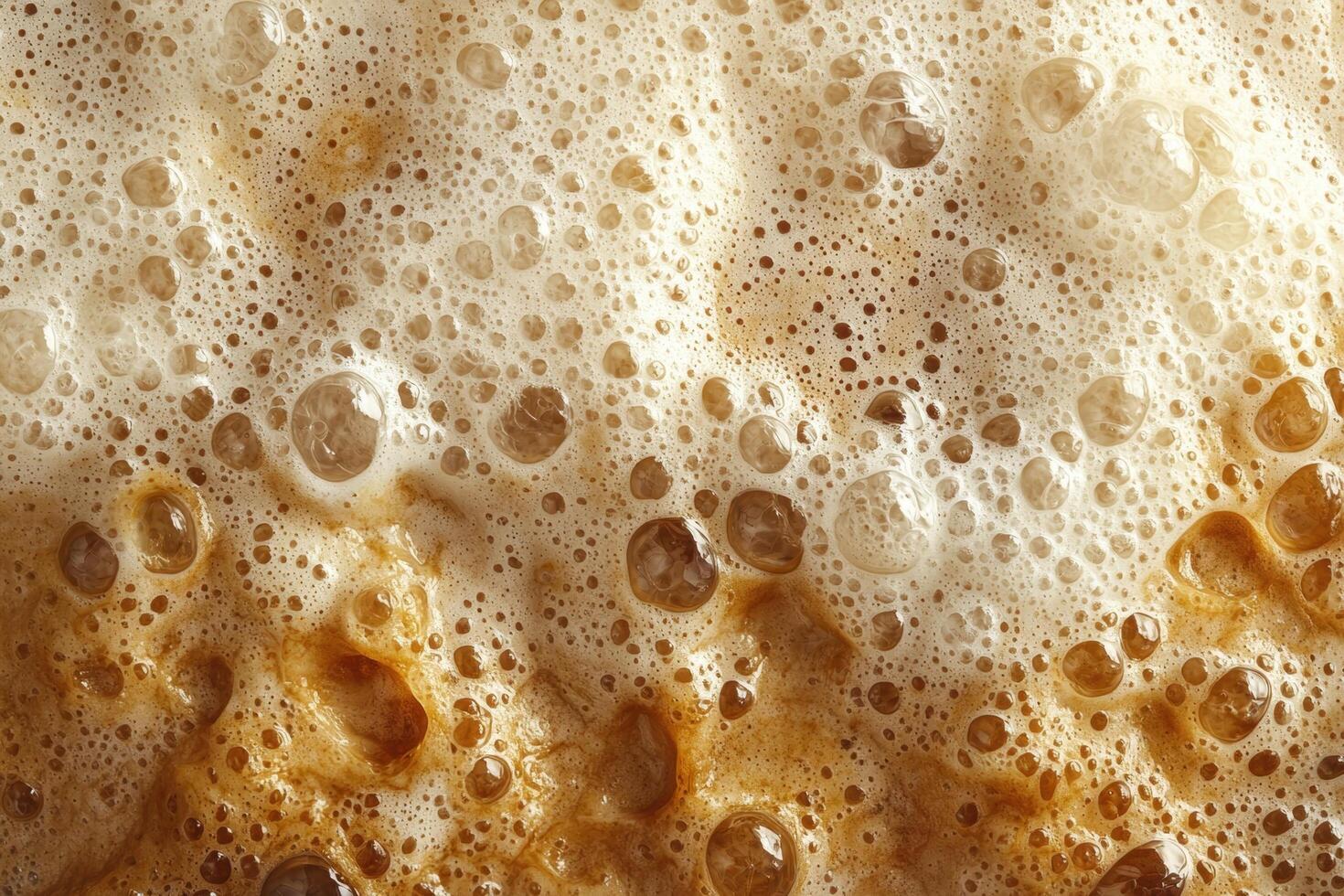 Close up of frothy beer with bubbles photo