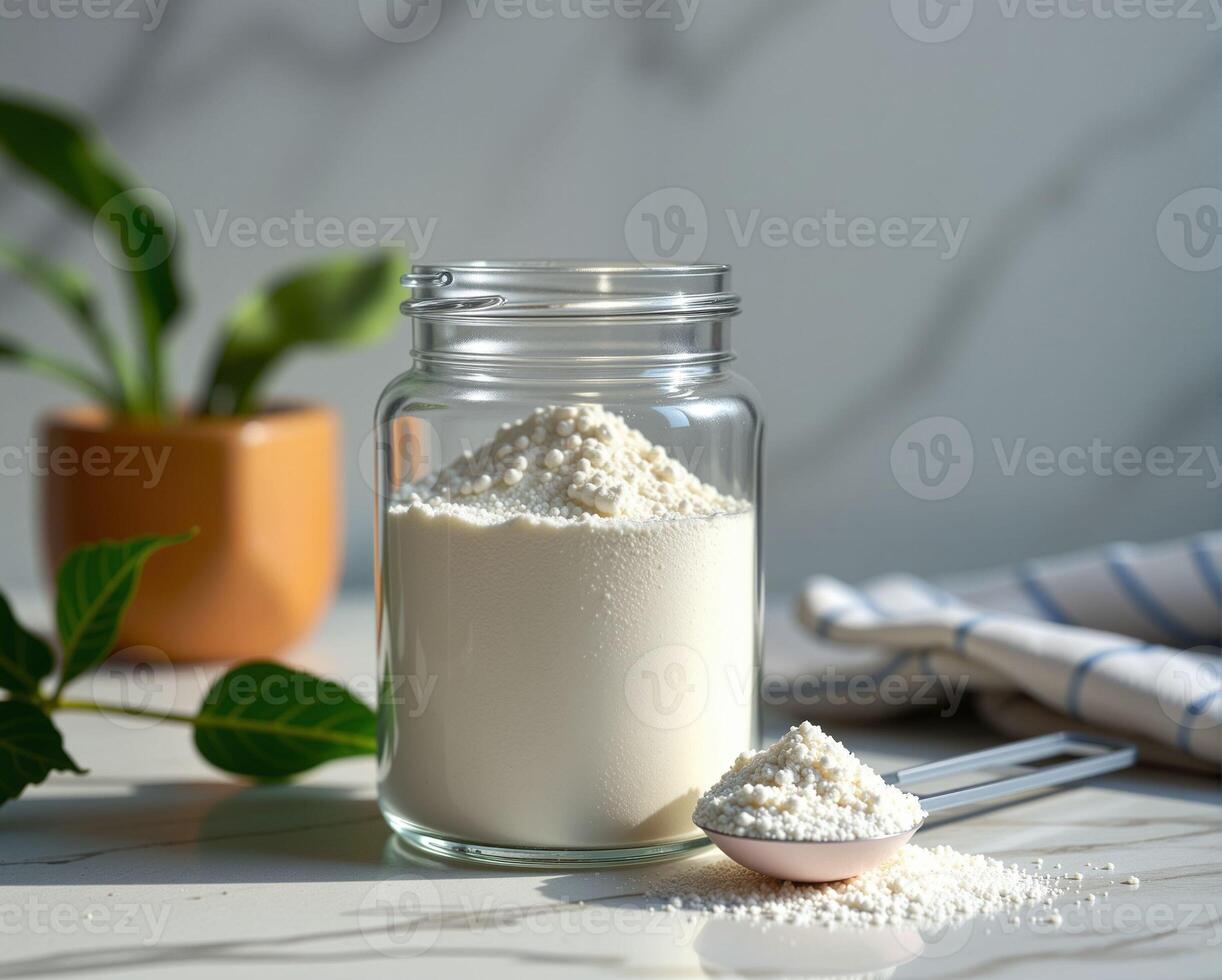 Glass Jar with Flour and Spoon on Table Beside Plant and Cloth photo