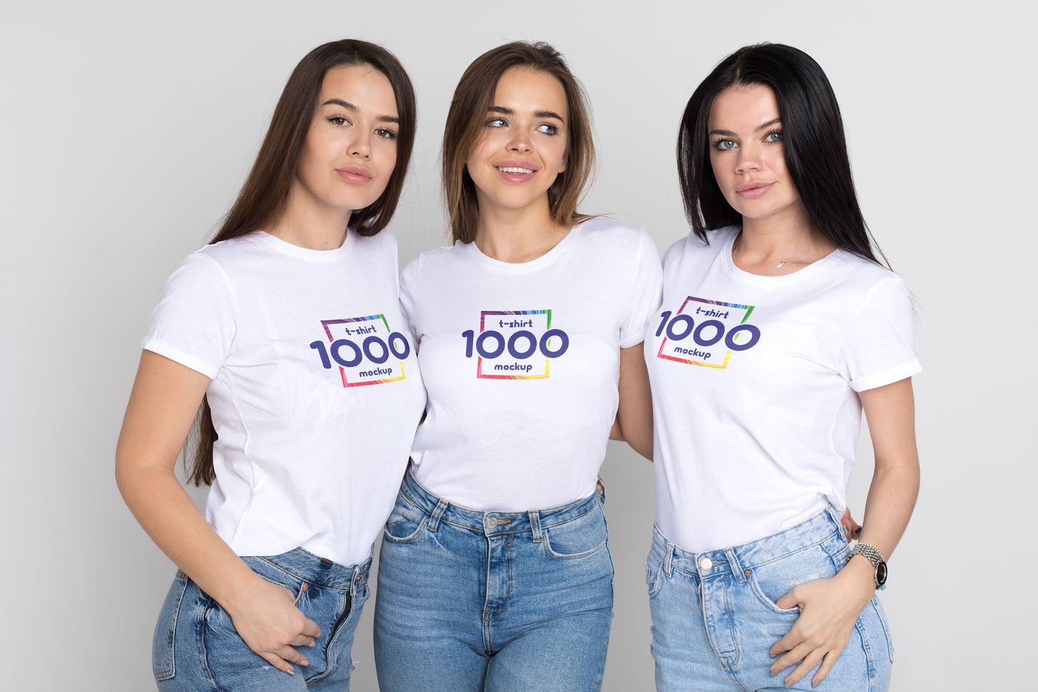 Three Young Women in White T-Shirts with a T-Shirt Mockup Design - Studio Shot psd