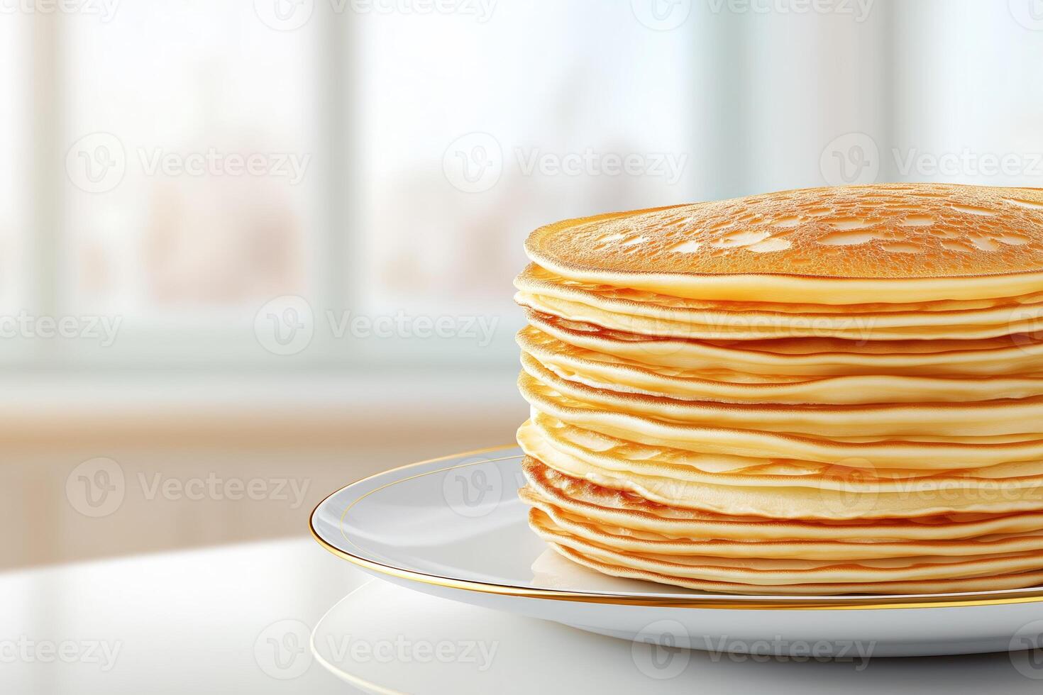 Pancakes on porcelain plate on white countertop, with copy space photo