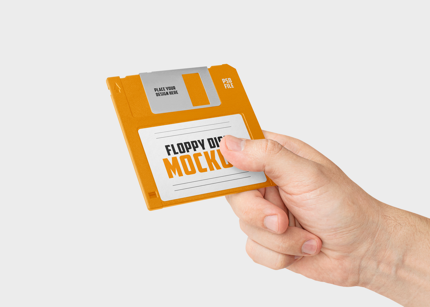 Hand Holding Floppy Disk Mockup psd