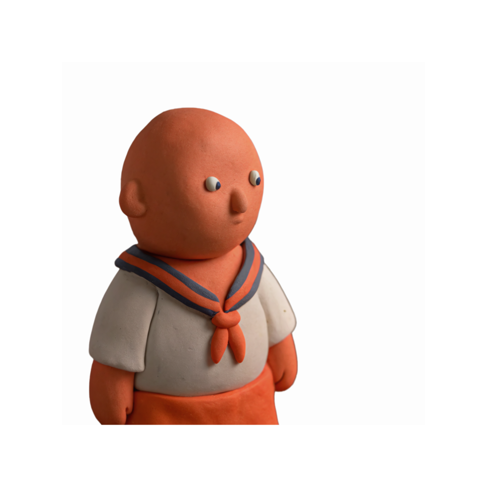 Clay Figurine of Bald Child in Sailor Outfit with Navy Blue and Orange Details on Transparent Background png