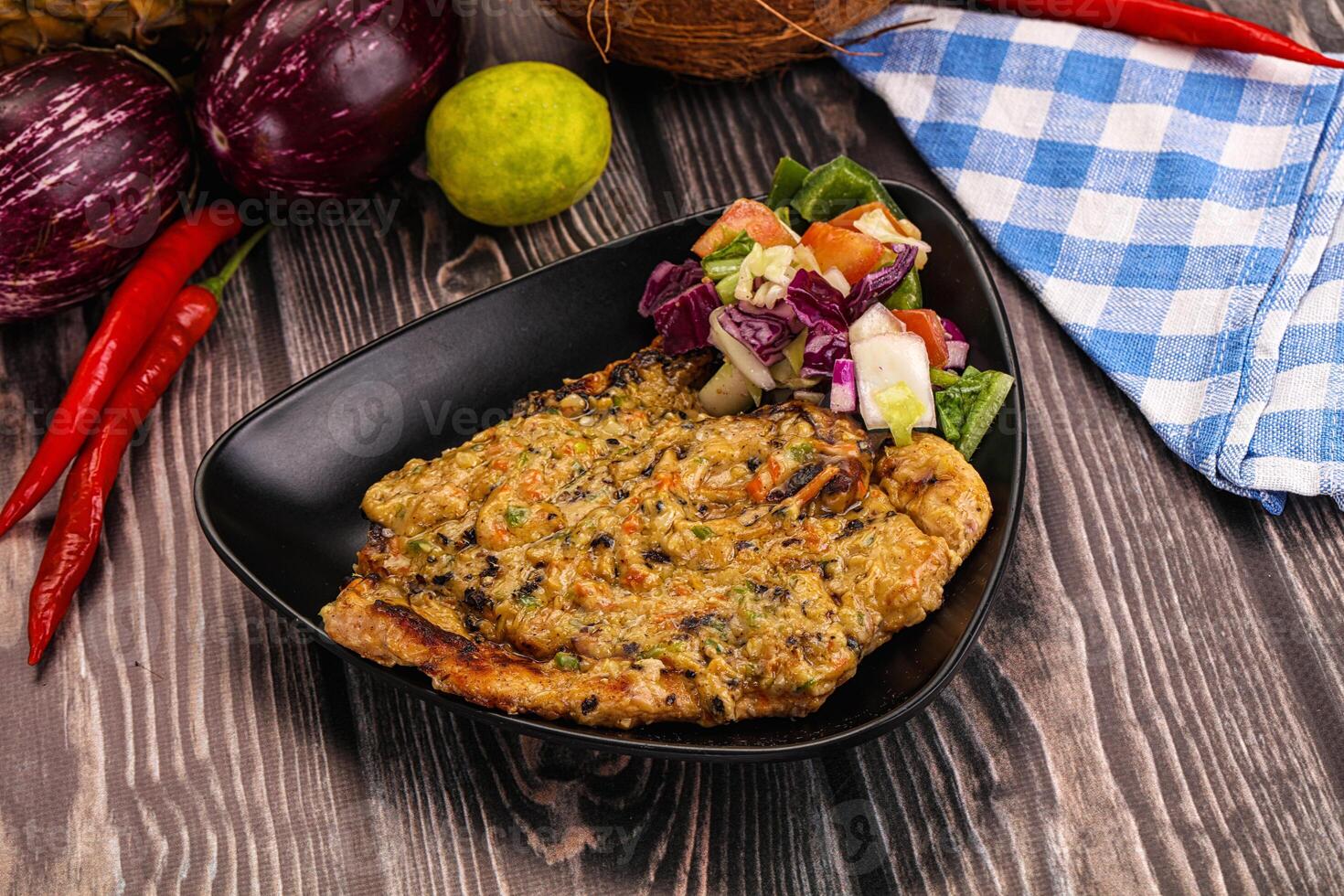 A plate of food with vegetables and a salad photo
