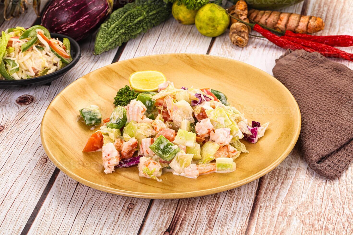 A plate of food on a table with other food photo