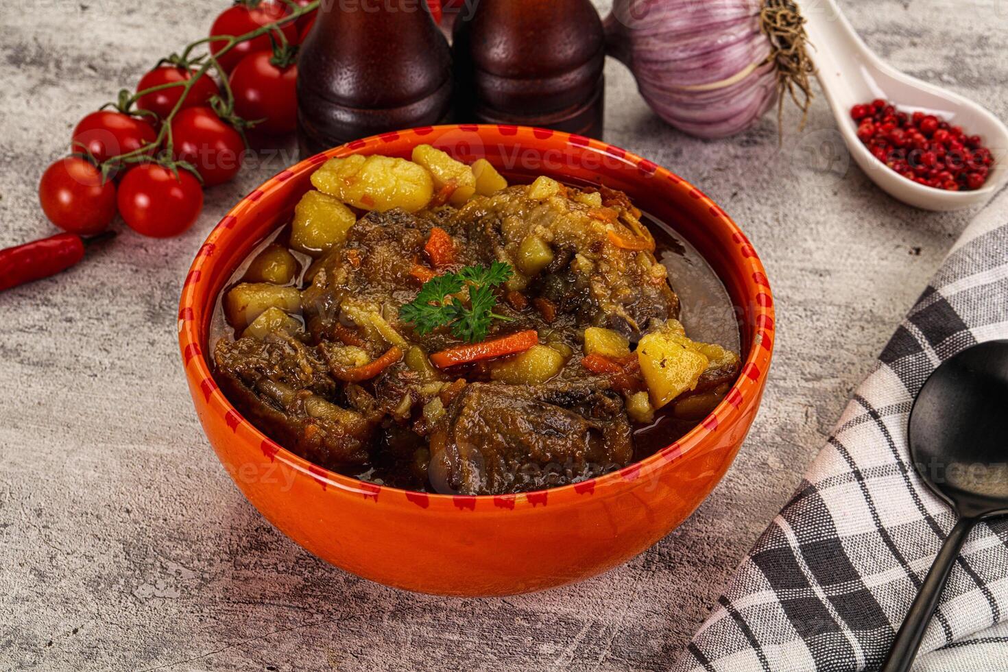 A bowl of stew with vegetables and meat photo