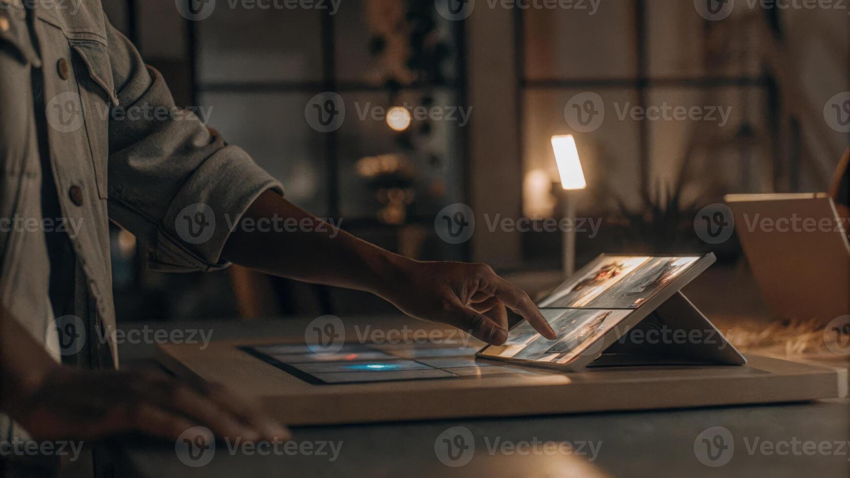 A person touching a holographic interface to customize a digital ad showcasing vibrant visuals and interactive elements surrounded by a serene workspace.. photo