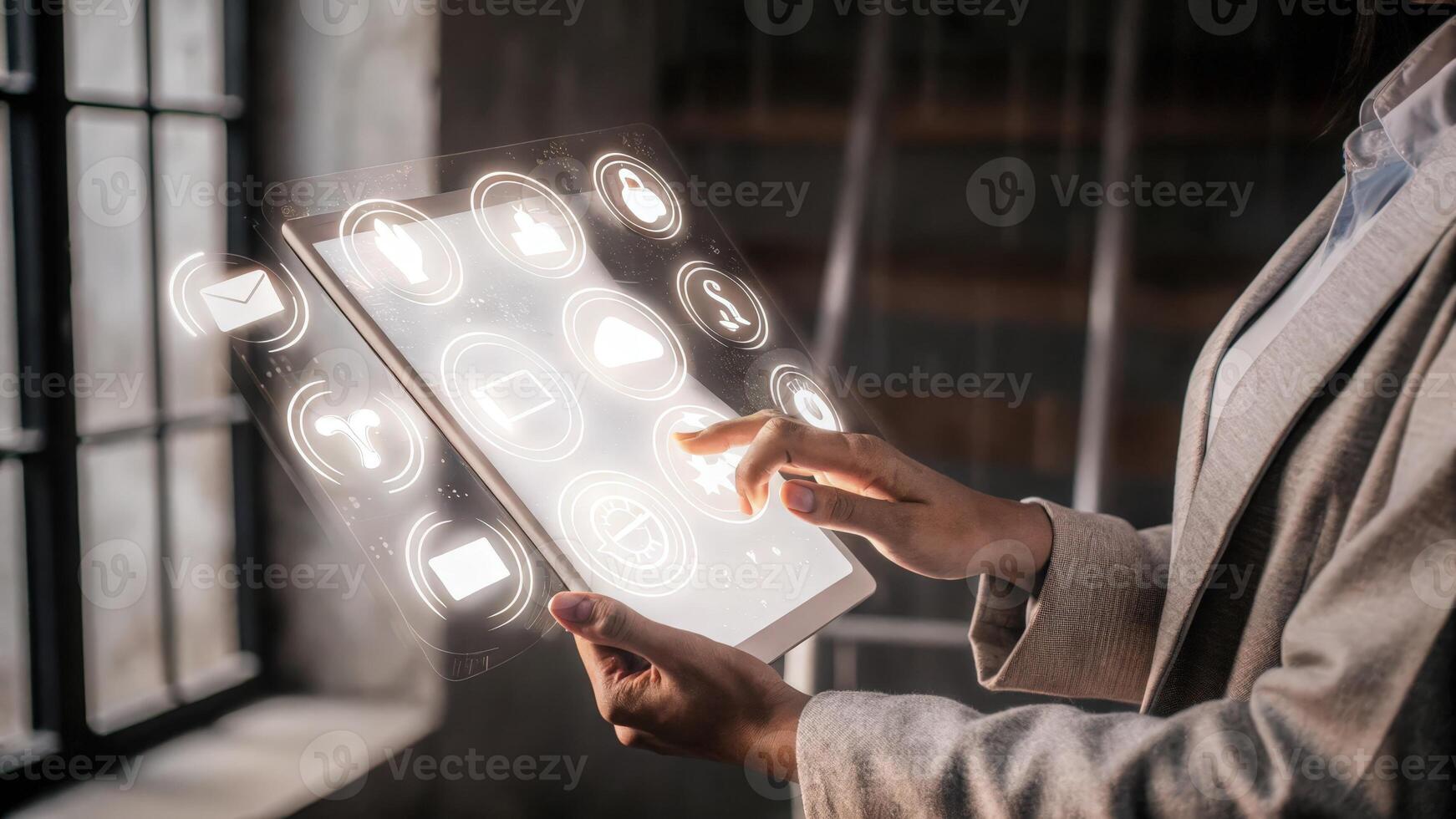 A focused user interacting with a holographic productivity tracker as icons and metrics swirl elegantly around their hand exhibiting seamless technology.. photo