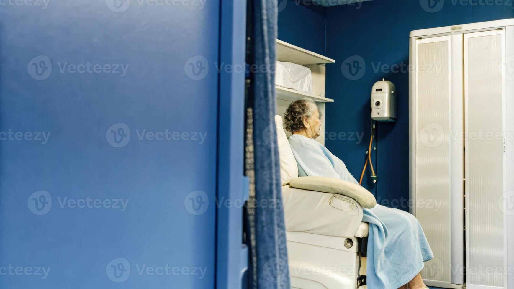their skin visibly red as they adjust the machine settings via a touch panel displaying temperatures and durations.. photo