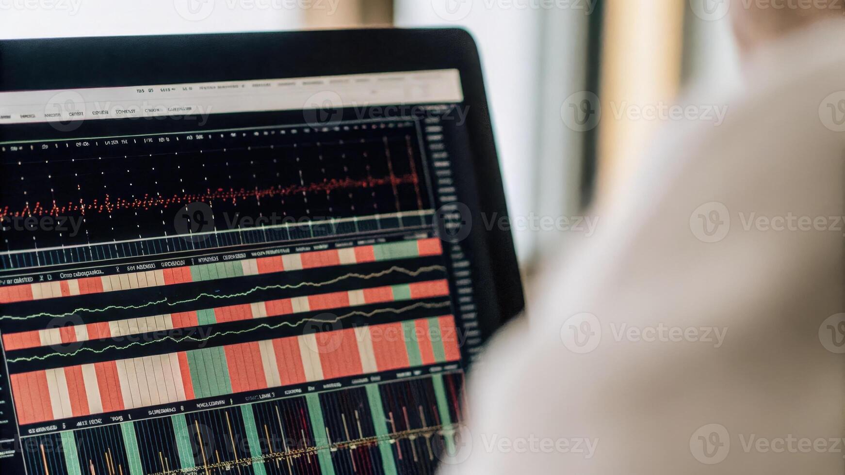 A close view of a personal computer monitor displaying bioinformatics software with colorful graphs and sequences from genetic analyses prominently shown.. photo