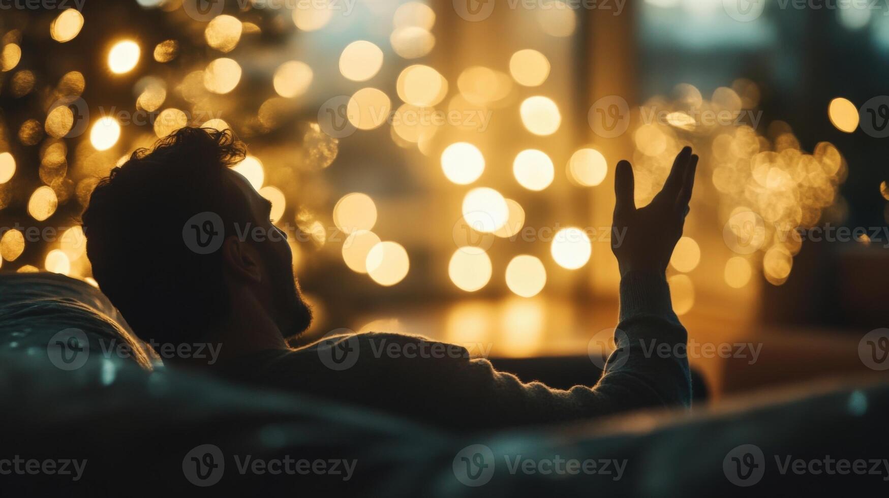 A midshot of a guest sitting on a plush couch animatedly gesturing while surrounded by dazzling blurred lights that cast an electrifying glow highlighting the intensity of the conversatio photo