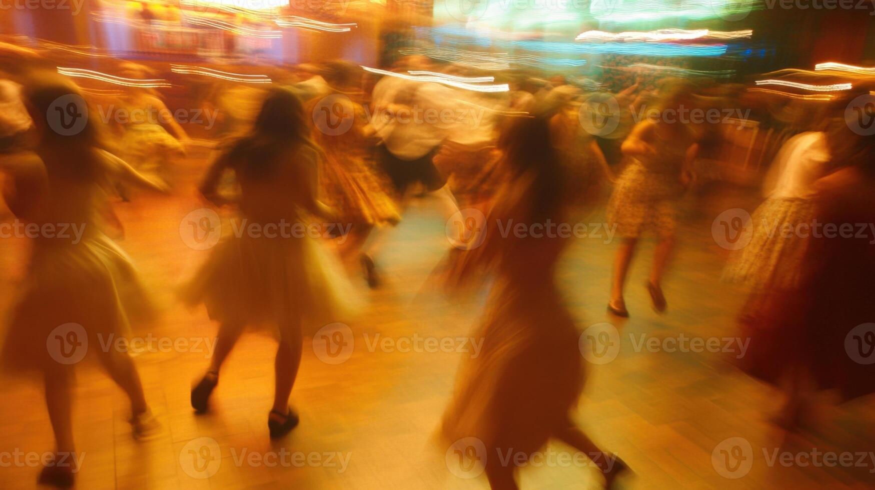 their movements are blurred emphasizing the energy and excitement of the dance contest atmosphere photo