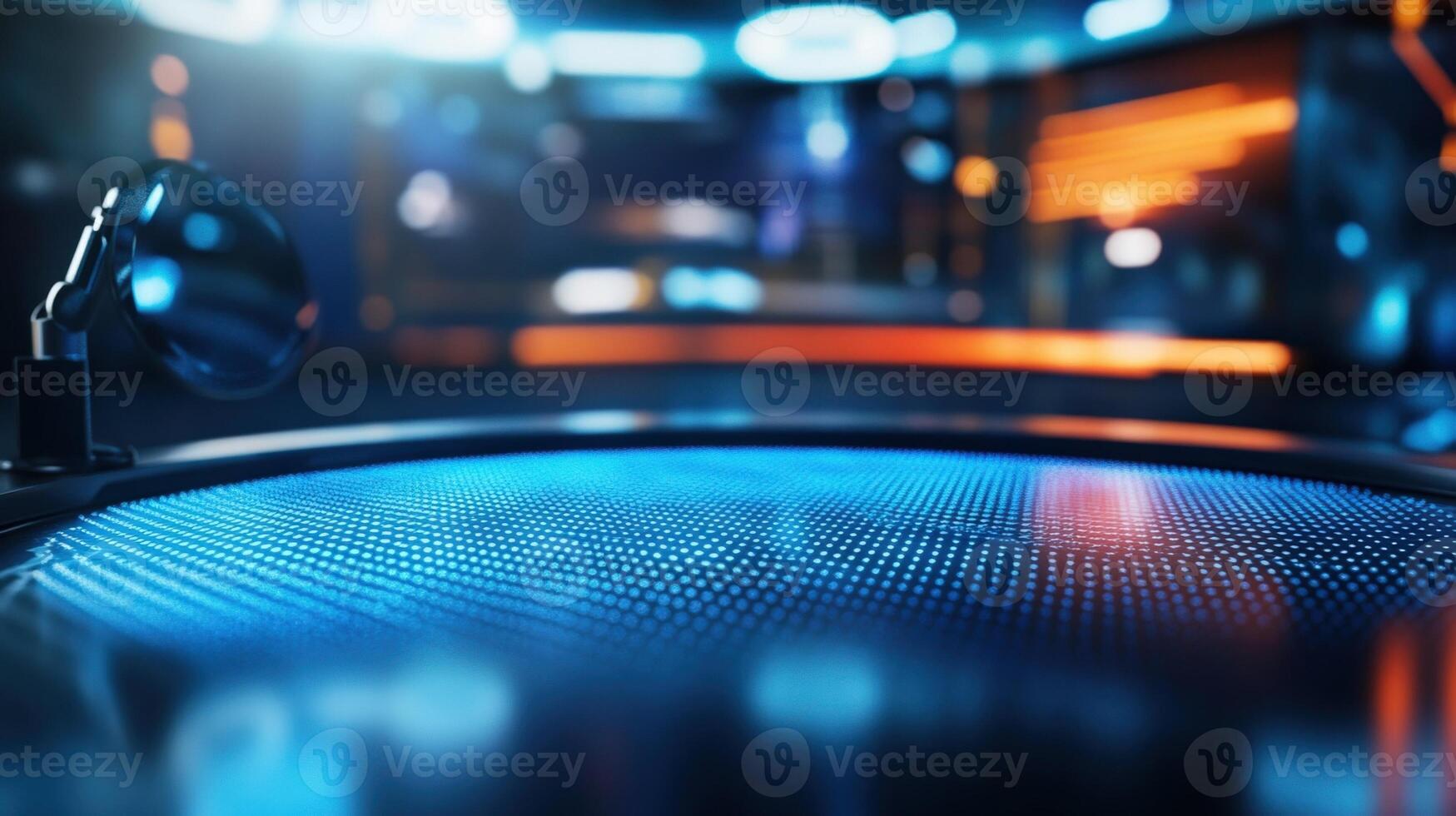 A closeup of a modern news anchors desk equipped with hightech gadgets and a glossy surface reflecting the ambient lights. The fuzzy outlines of colleagues discussing offcamera creat photo