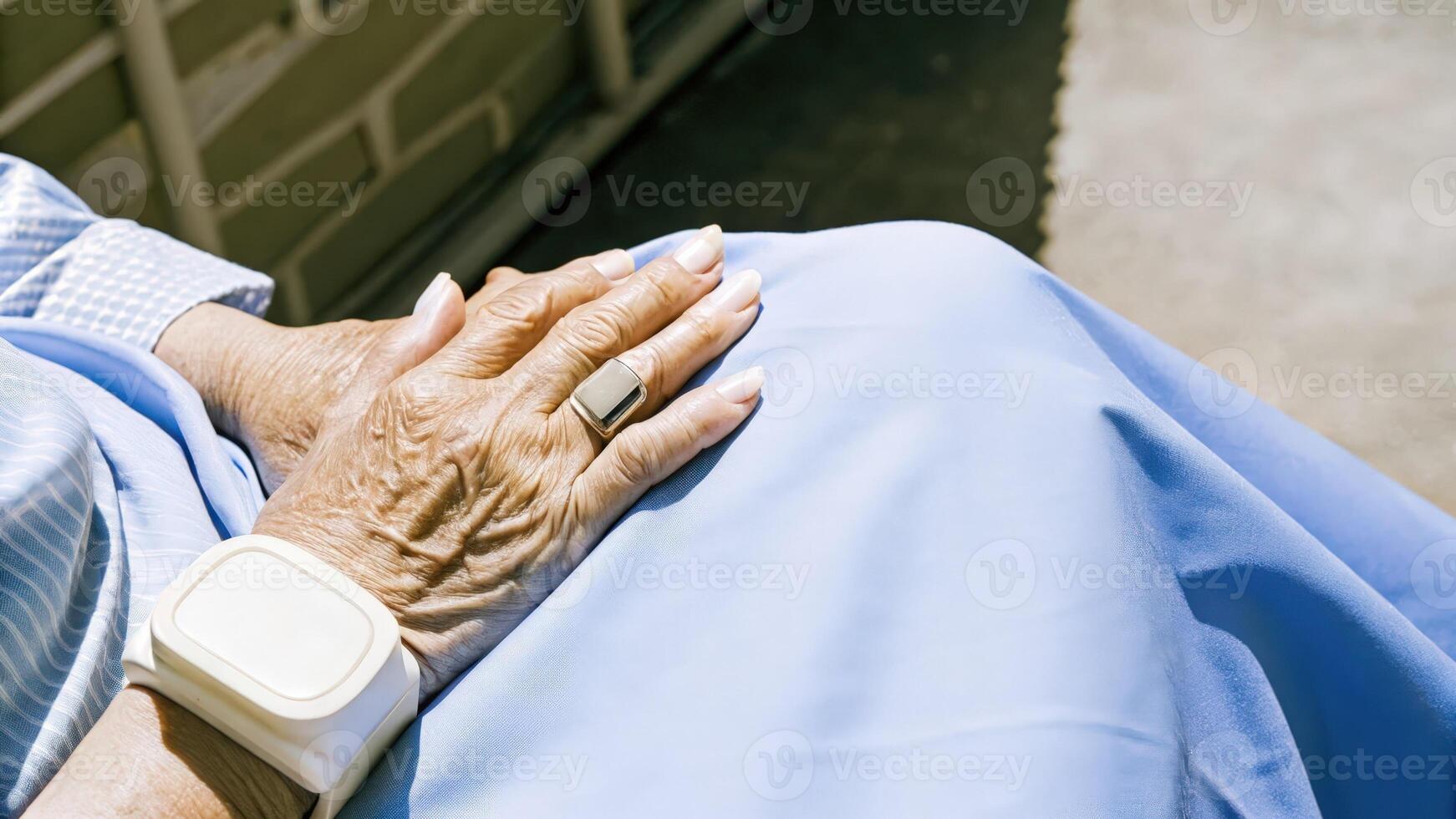 Hands of an older person resting on a lap with delicate designs of the neural stimulation device contrasting against their skin symbolizing the blend of wisdom and innovation.. photo
