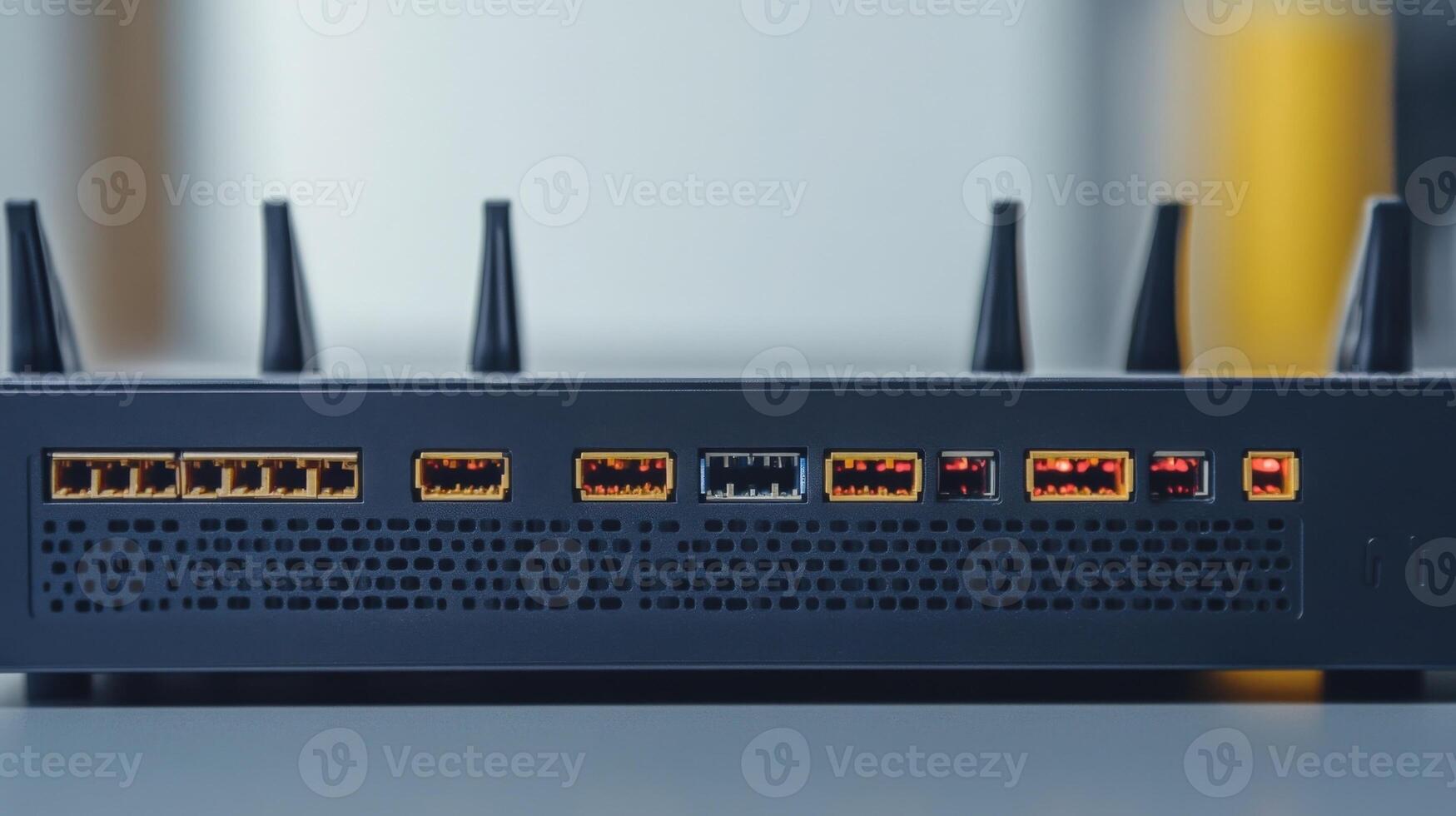 An isolated view of the back panel of a wireless router showcasing multiple input and output ports LED indicators and ventilation grills all designed for efficient signal processin photo