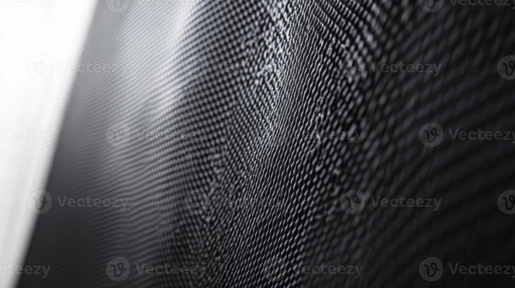 Wavy black grid reflecting light creating abstract pattern photo